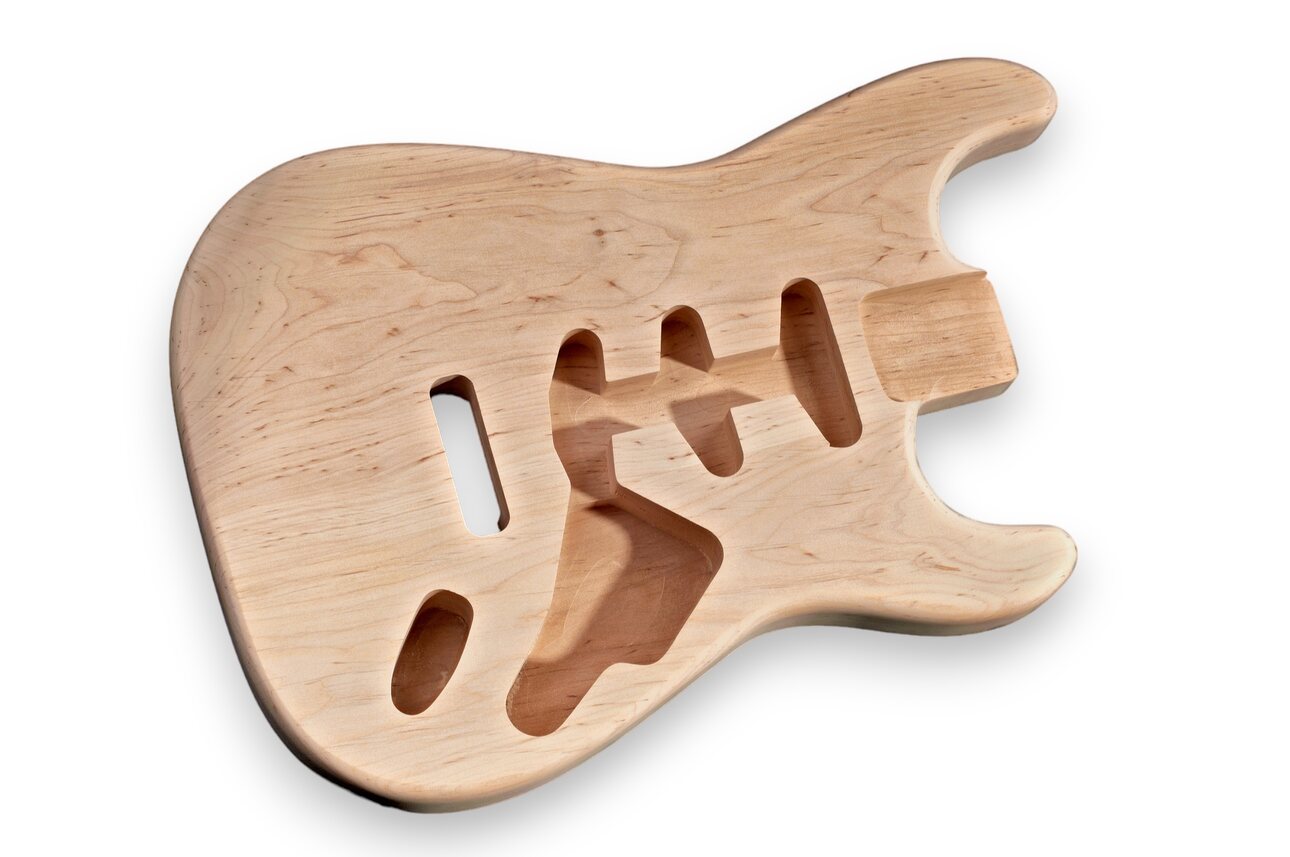 A bare wood Stratocaster electric guitar body.