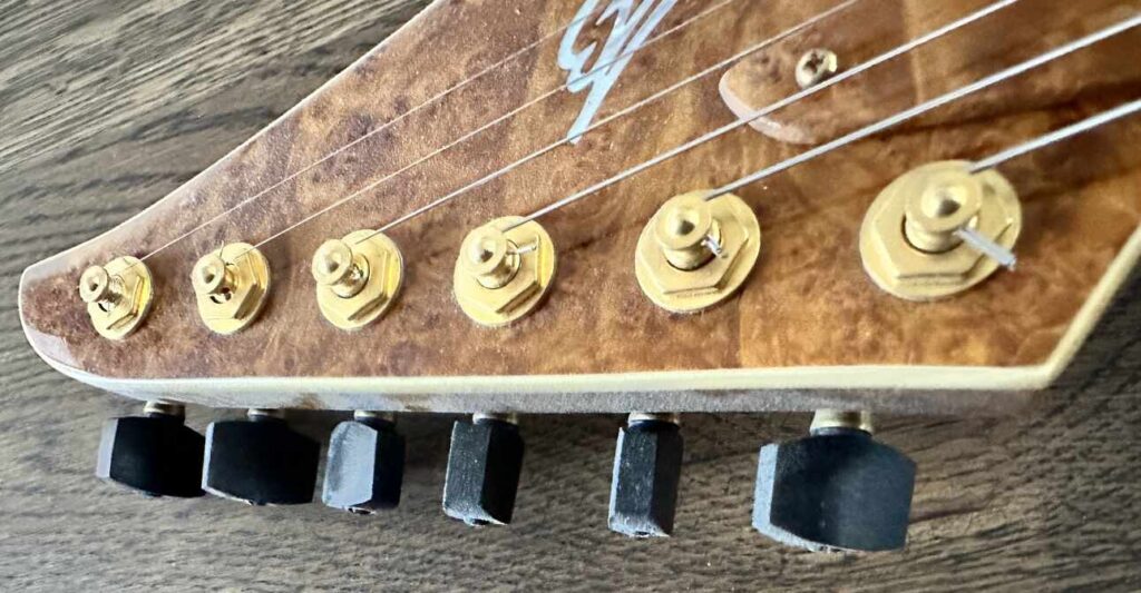 Sperzel tuning pegs on the headstock of a custom-built electric guitar.