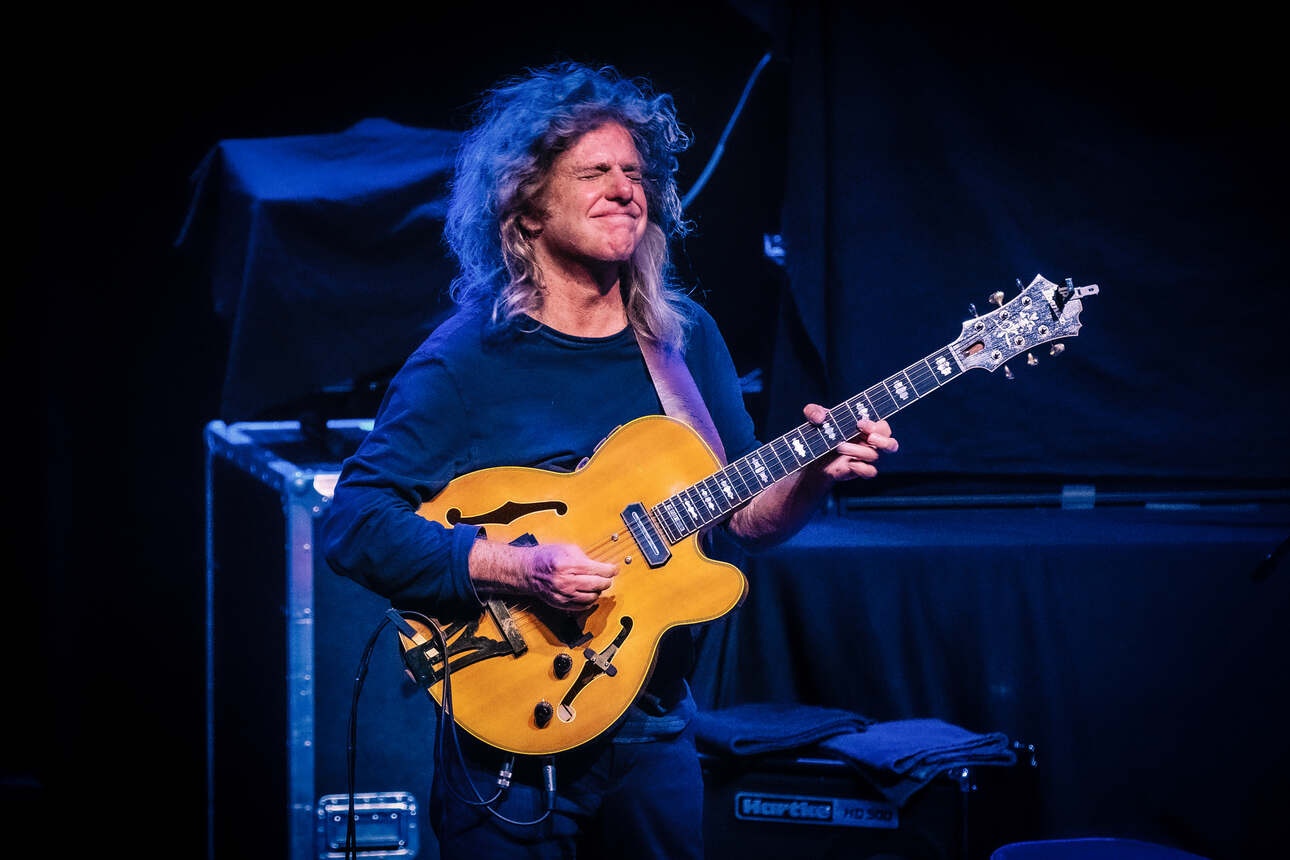 Pat Metheny plays a yellow semi electric guitar live on stage in Tivoli Vredenburg, the Netherlands.