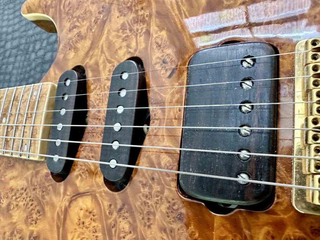 Closeup of Lindy Fralin pickups on custom built electric guitar.