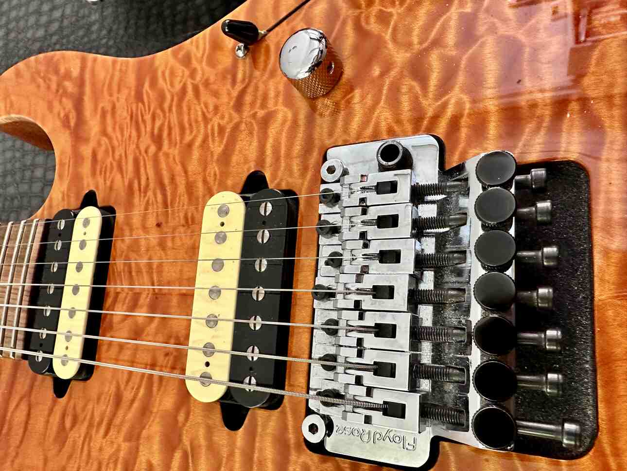 Closeup of Suhr pickups on a Suhr electric guitar.