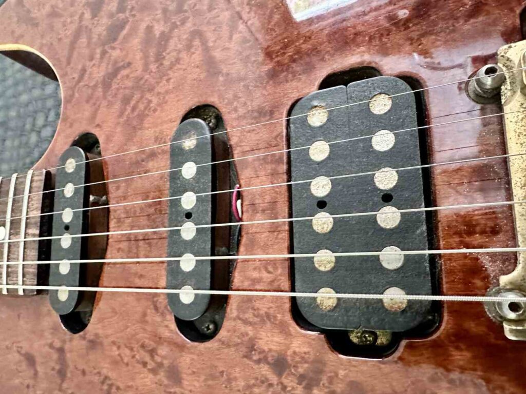 Closeup of Tom Anderson pickups on a Schecter Hollywood Custom ltd electric guitar.