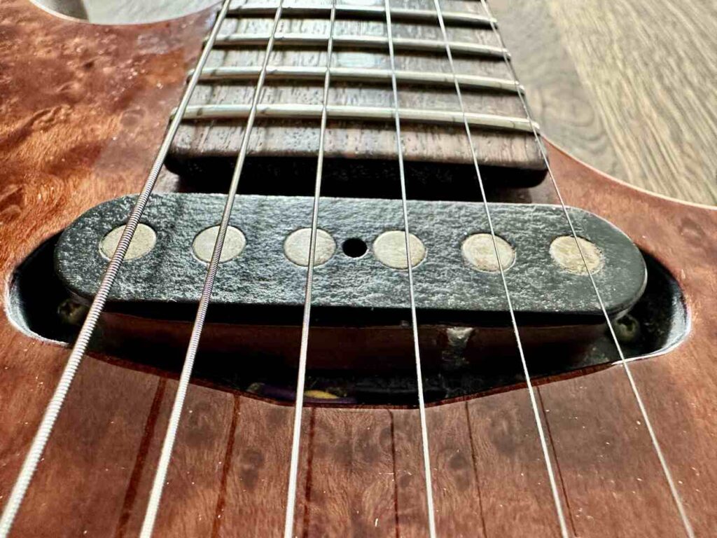 Closeup of a Tom Anderson single coil pickup on a Schecter Hollywood Custom ltd. electric guitar.