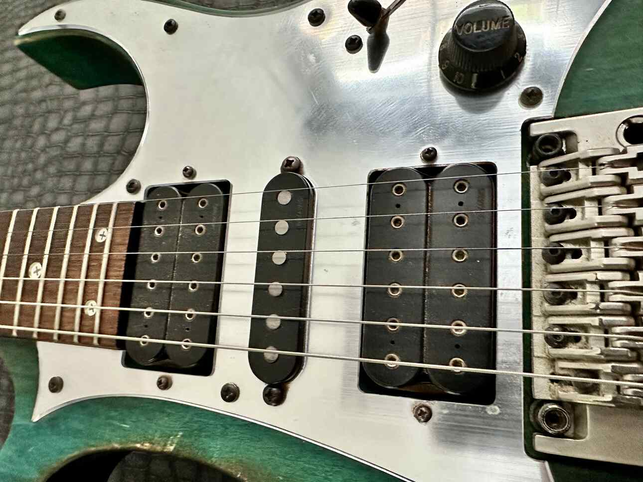 Closeup of a HSH pickup configuration on an Ibanez Jem BSB.