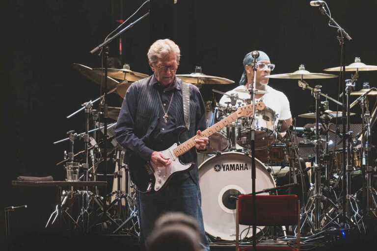 Eric Clapton playing his black Fender Stratocaster called "Blackie" live on stage.