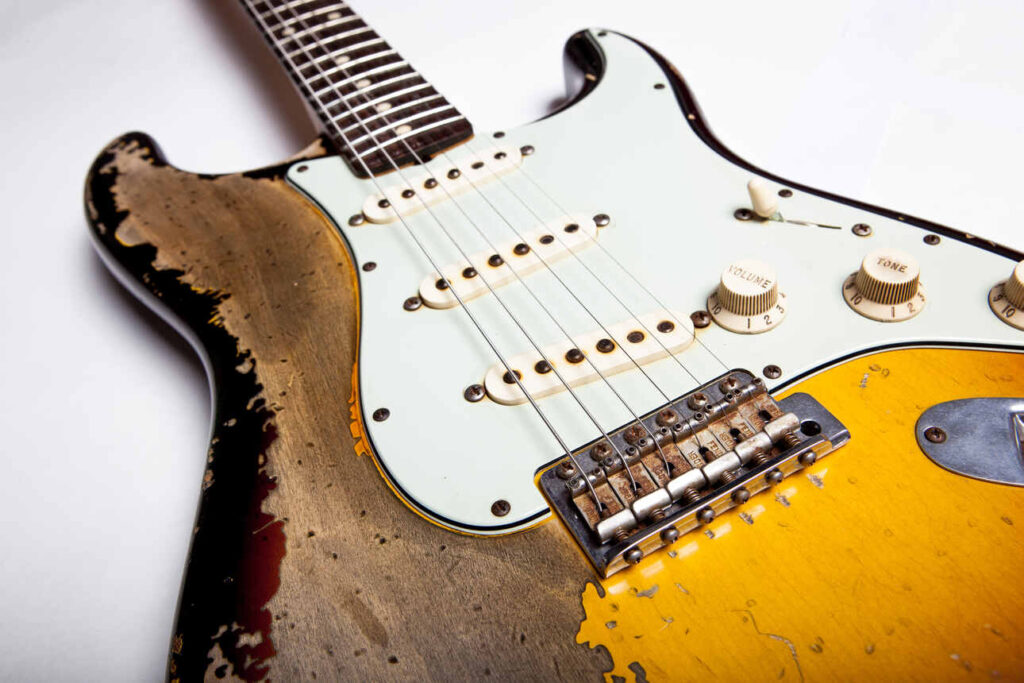 A relic Fender Stratocaster with an SSS pickup configuration.