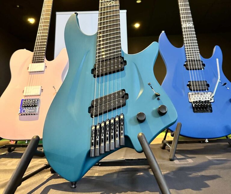A light blue solid color finish on an Aristides electric guitar.