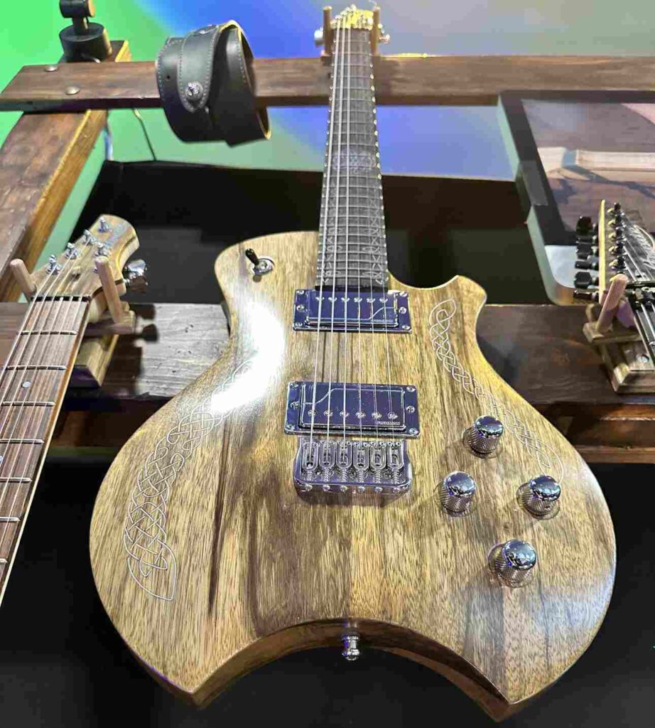 An electric boutique guitar with a gloss finish.