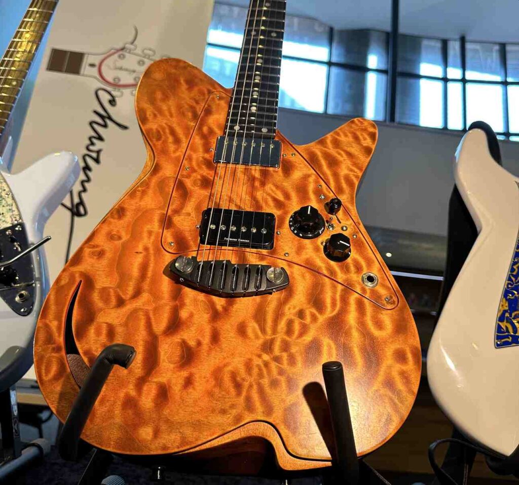 A brown boutique guitar with a nitro cellulose finish.