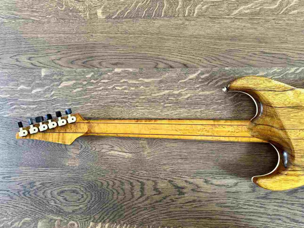 Backside of the guitar neck of a custom-built axe.