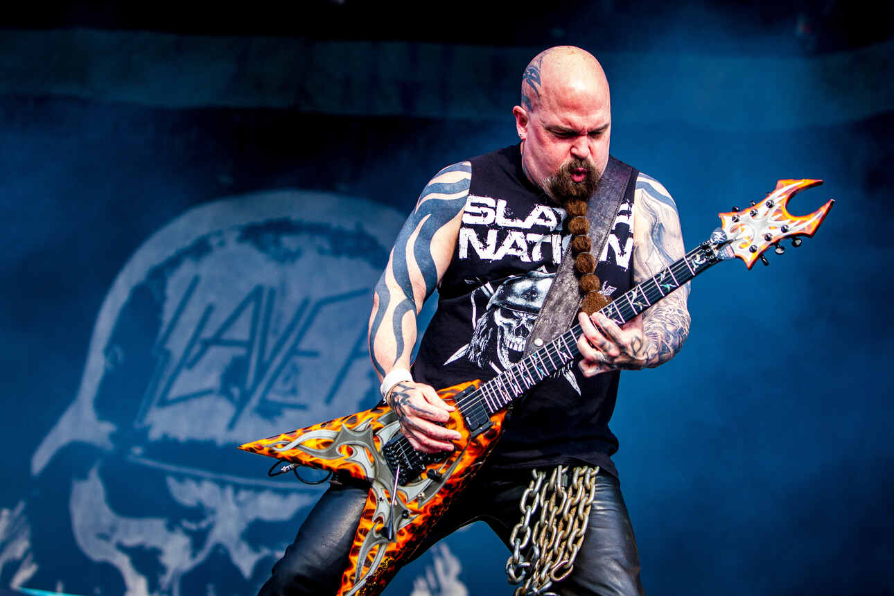 Slayer guitarist Kerry King playing a BC Rich Flying V on stage.