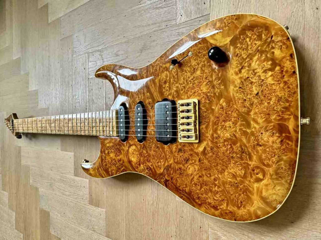 A six-string custom-built guitar seen from above.