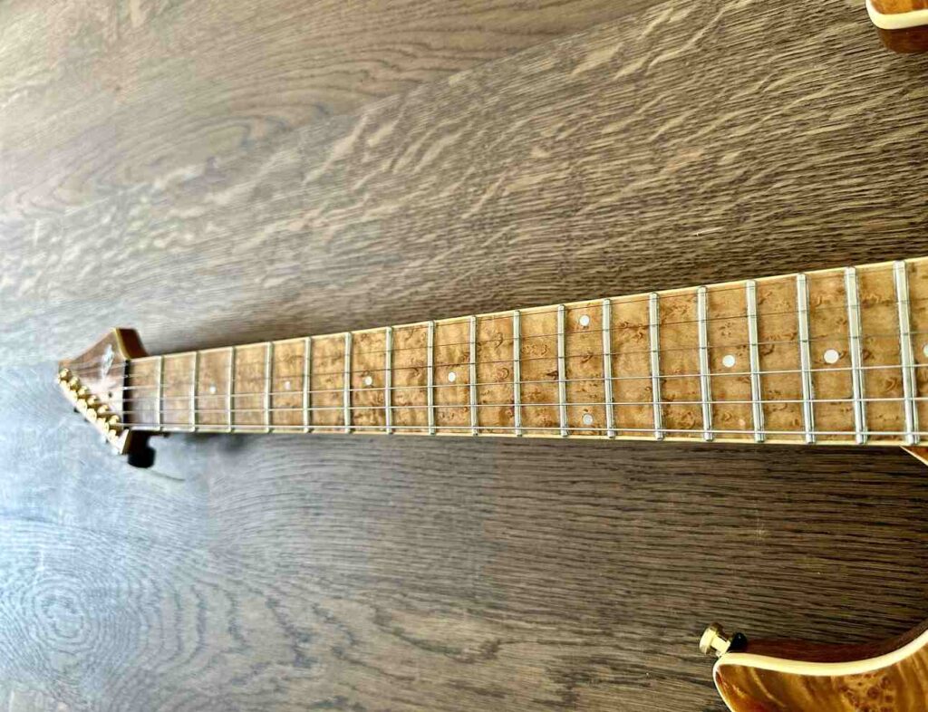 Tapered neck on a custom-built electric guitar.