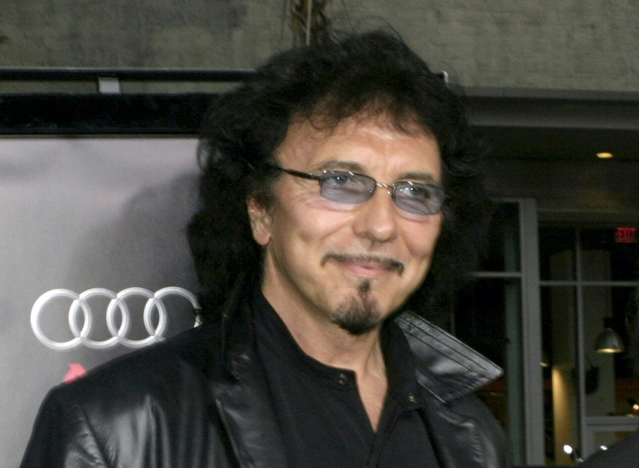 Tony Iommi of Black Sabbath wearing blue-tinted glasses.